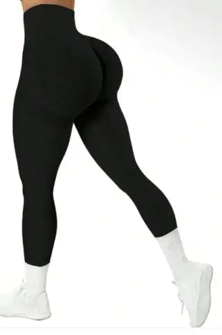 Black leggings worn by a person on a white background