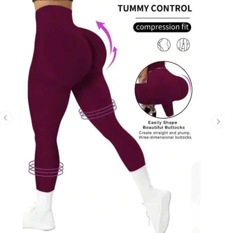 Maroon leggings with compression fit feature on a white background